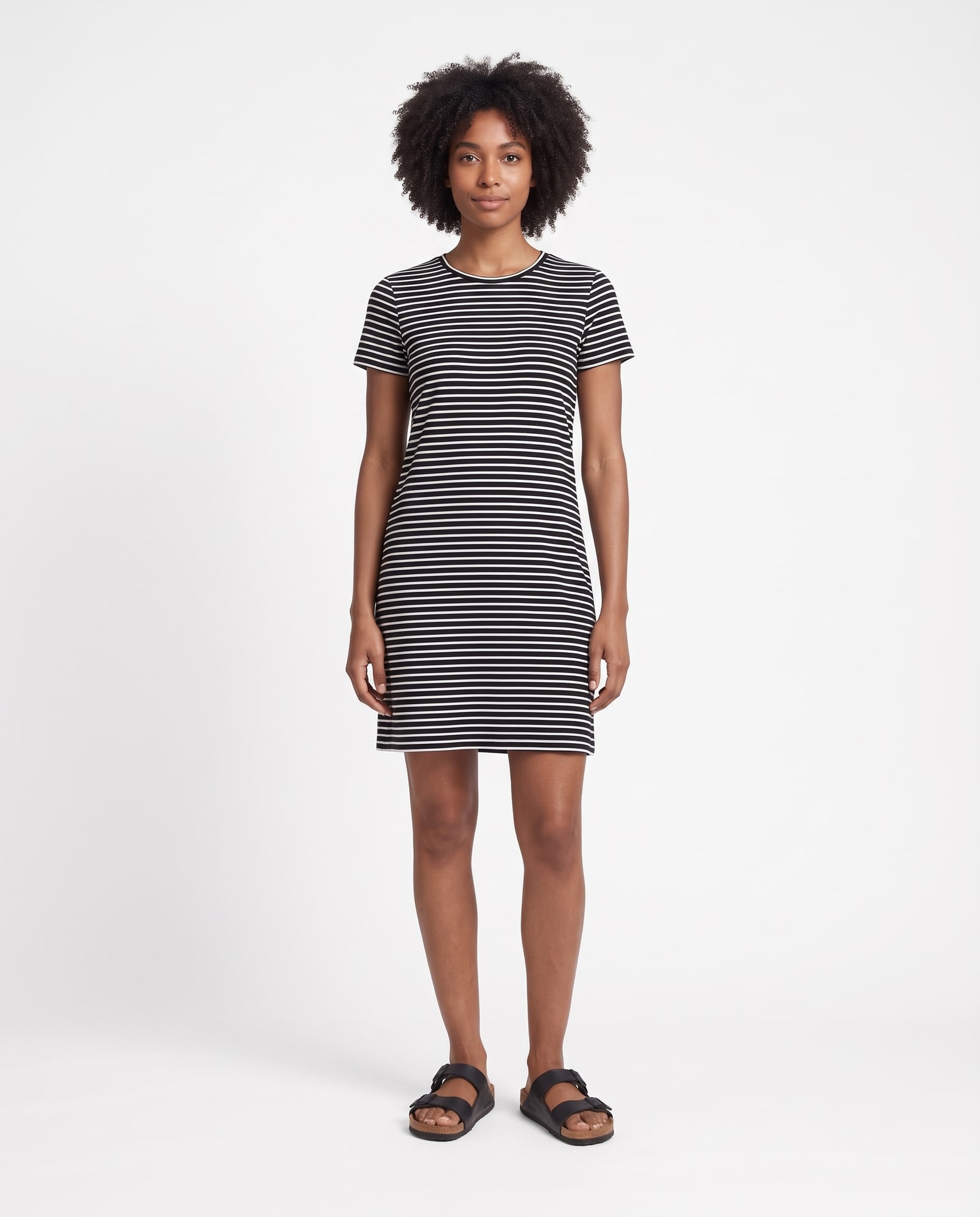 Model wearing the striped t-shirt dress in a pure-white marketplace background