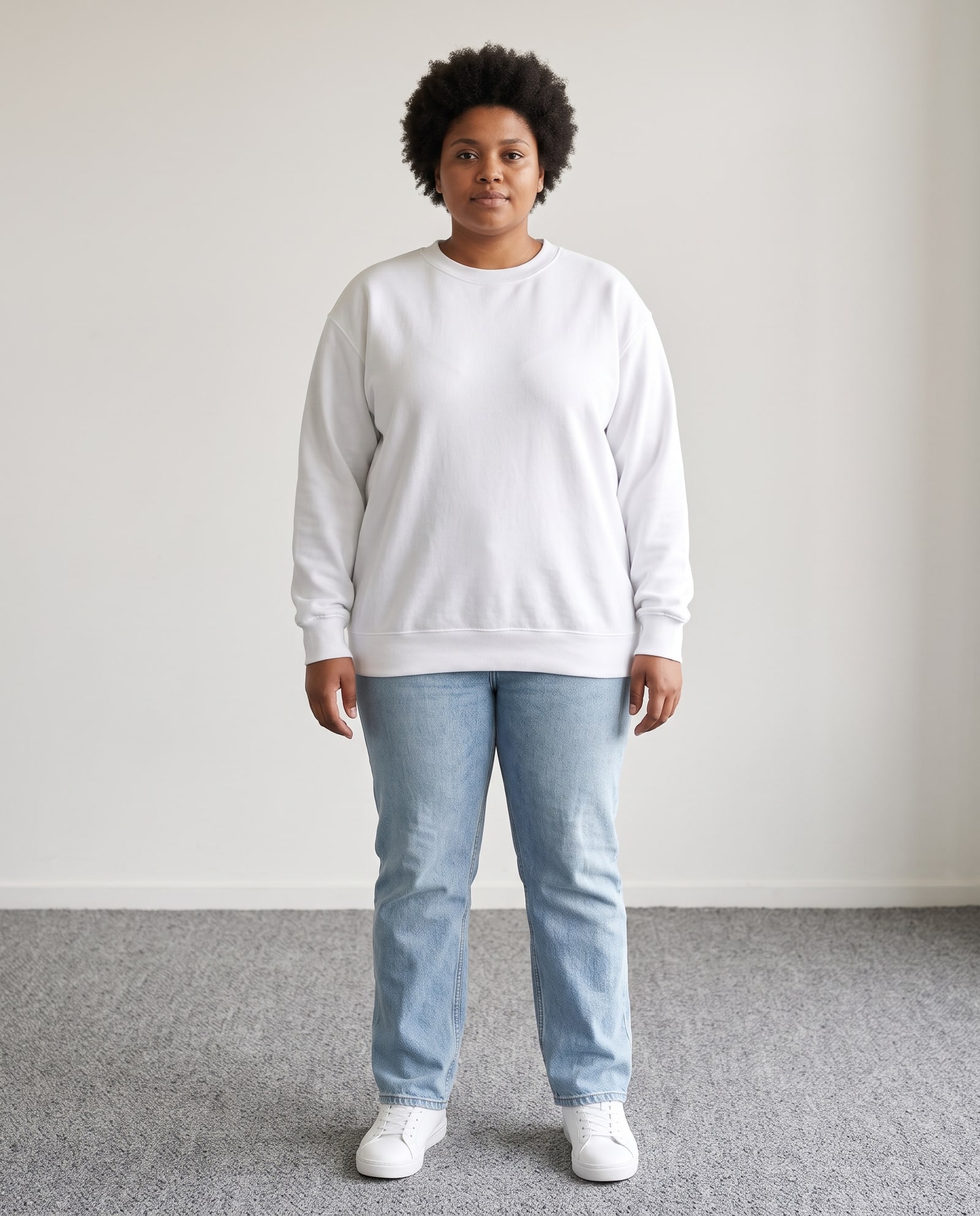 Model wearing the white crewneck sweatshirt in a bright room with grey carpet